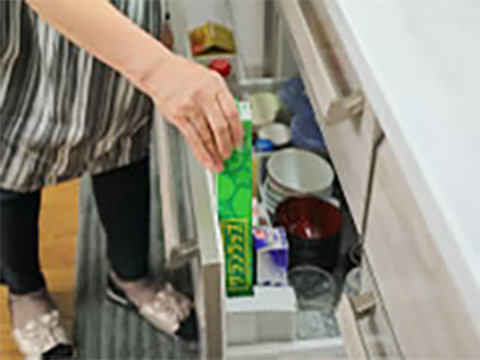 Put the plastic wrap upright in the front so all you have to do is open the drawer for easy access.