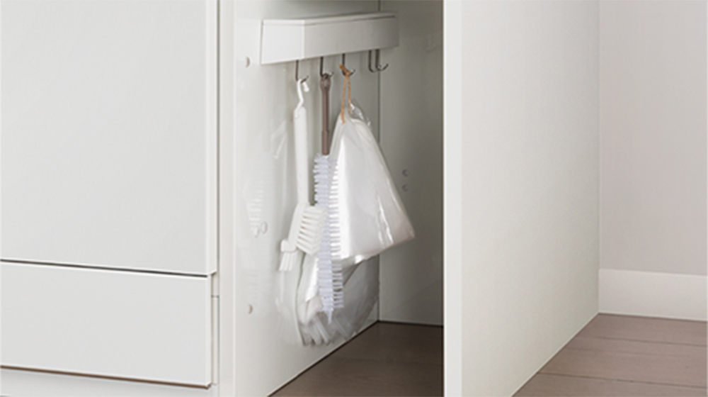 Since the cabinet is made of enamel, you can use the separately sold magnetic anywhere rack to organize cleaning supplies and other items.