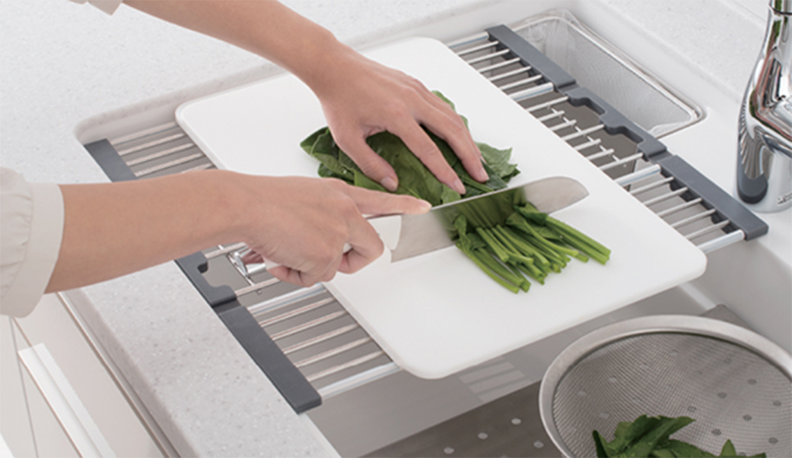 Place your cutting board horizontally or vertically on the sink instead of using the worktop